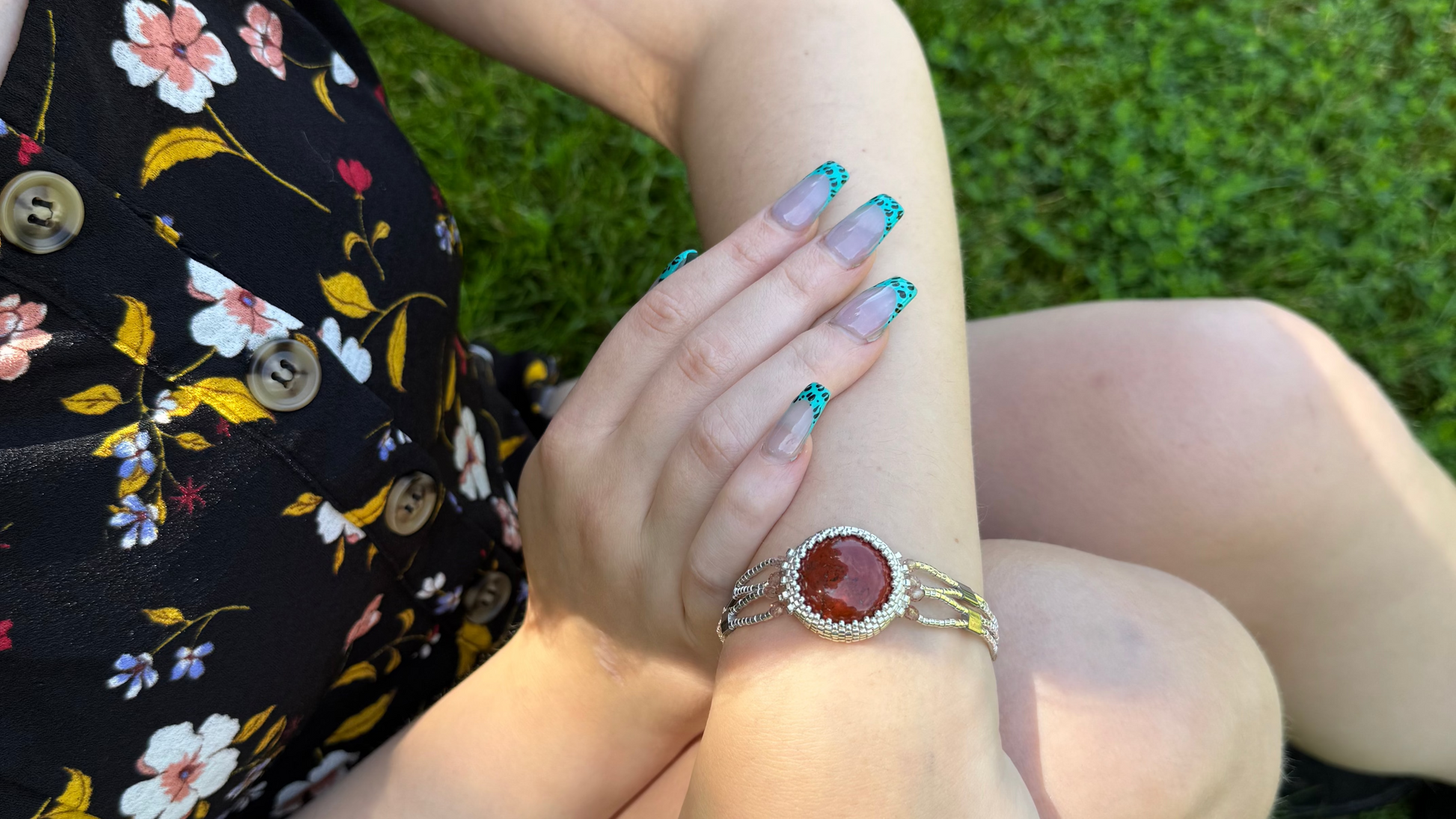 Silver handmade beaded bracelet with red jasper cabochon for stability and security in crystal healing.